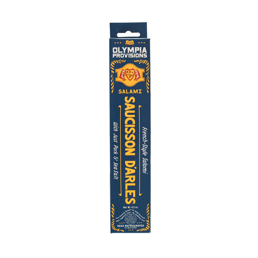 Olympia Provisions Saucisson d'Arles with pork and sea salt, packaged in a blue box.