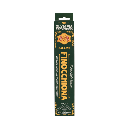 Olympia Provisions Salami Finocchiona with garlic, fennel seed, and ground pepper, packaged in a green box.