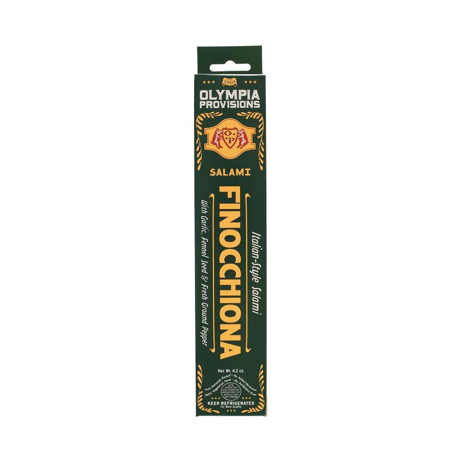 Olympia Provisions Salami Finocchiona with garlic, fennel seed, and ground pepper, packaged in a green box.