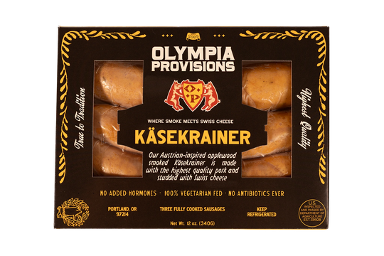 Olympia Provisions Kasekrainer Sausage with Swiss cheese, packaged in a black box.