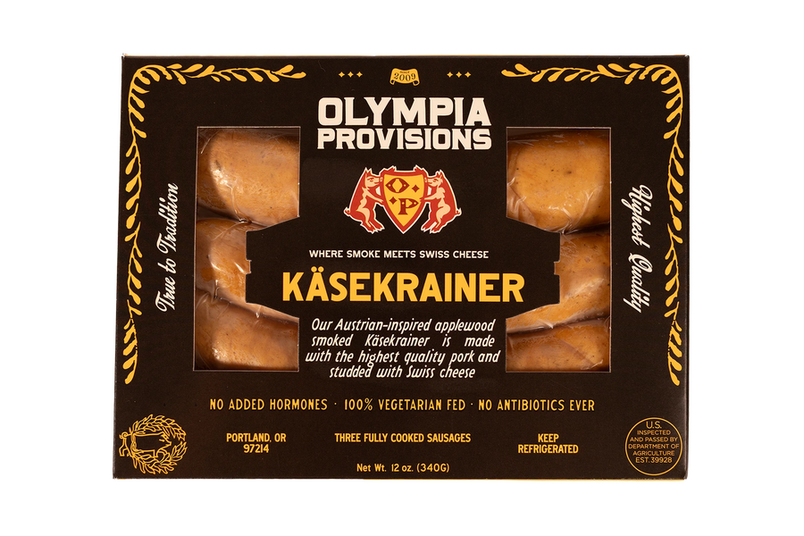 Olympia Provisions Kasekrainer Sausage with Swiss cheese, packaged in a black box.