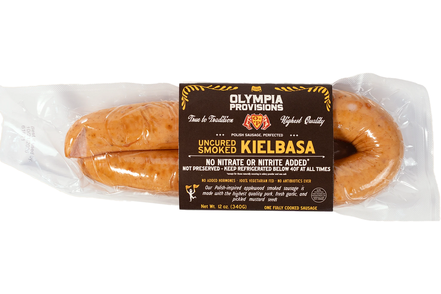 Olympia Provisions Polish Kielbasa with garlic and mustard seeds, in black packaging.