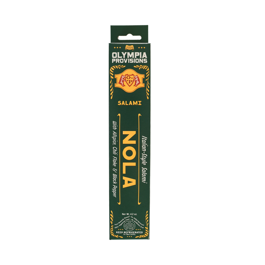 Olympia Provisions Salami Nola with allspice, chili flake, and black pepper, packaged in a green box.