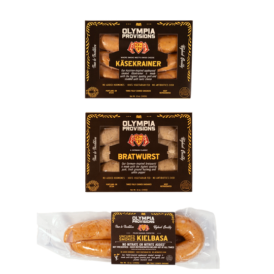 Olympia Provisions Kasekrainer, Bratwurst, and Kielbasa in black packaging.