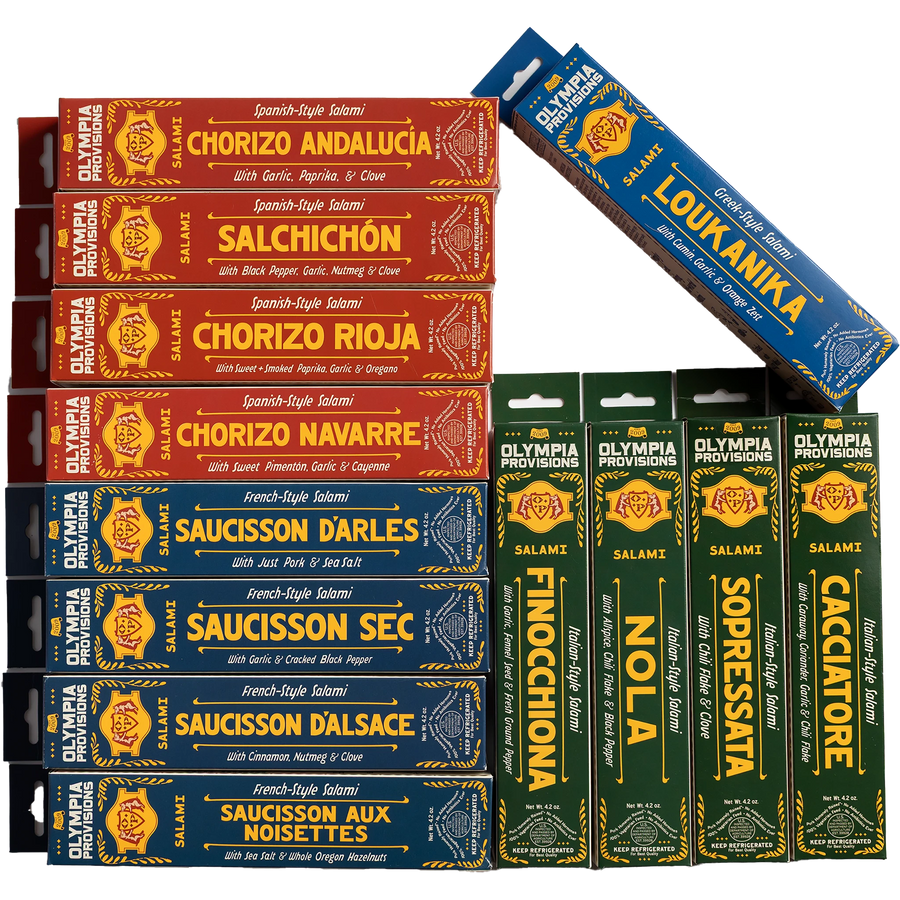 Twelve assorted Olympia Provisions salamis in French, Spanish, Greek, and Italian varieties.