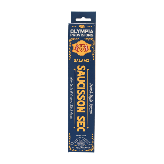 Olympia Provisions Saucisson Sec with garlic and black pepper, packaged in a blue box.