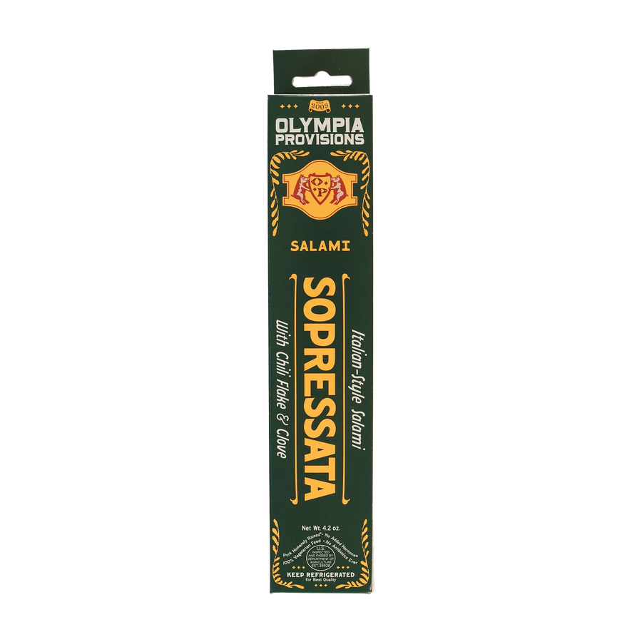 Olympia Provisions Salami Sopressata with chili flake and clove, packaged in a green box.
